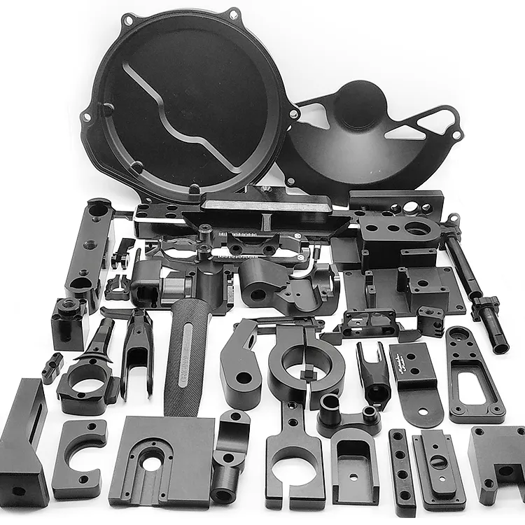 Large group of black anodised machined brackets, plates and housings
