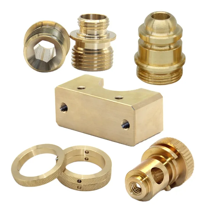 Machined brass fittings, rings and a rectangular block with threaded holes