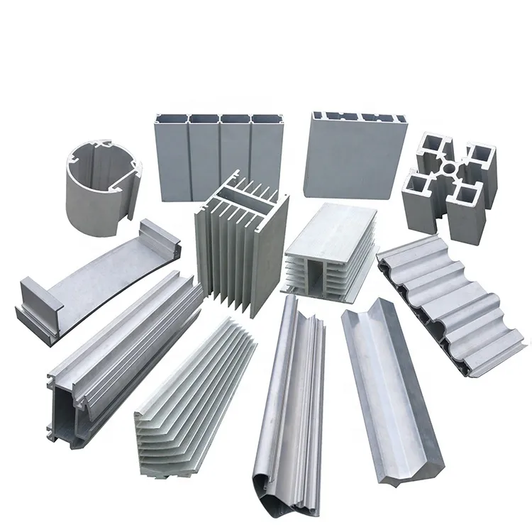 Assorted silver aluminium extrusions including a heatsink, a round section and ribbed profiles