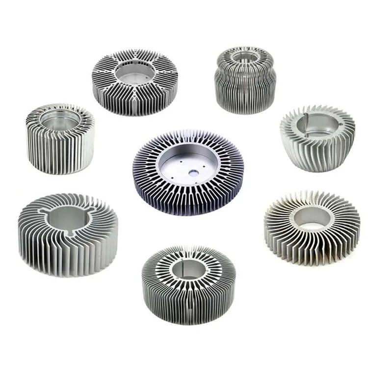 Eight round aluminium heatsinks with radial fins in different designs