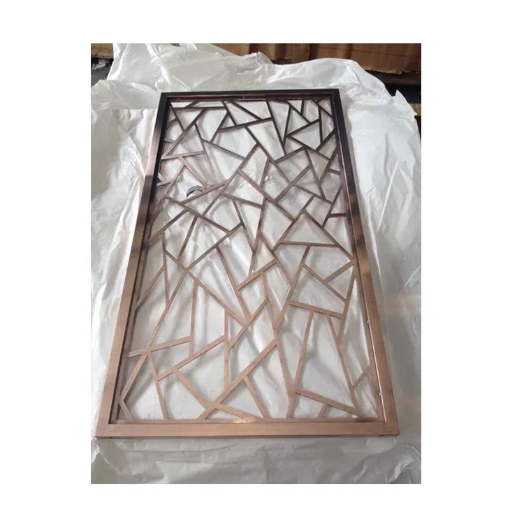 Framed bronze-coloured aluminium screen with an angular cut-out pattern