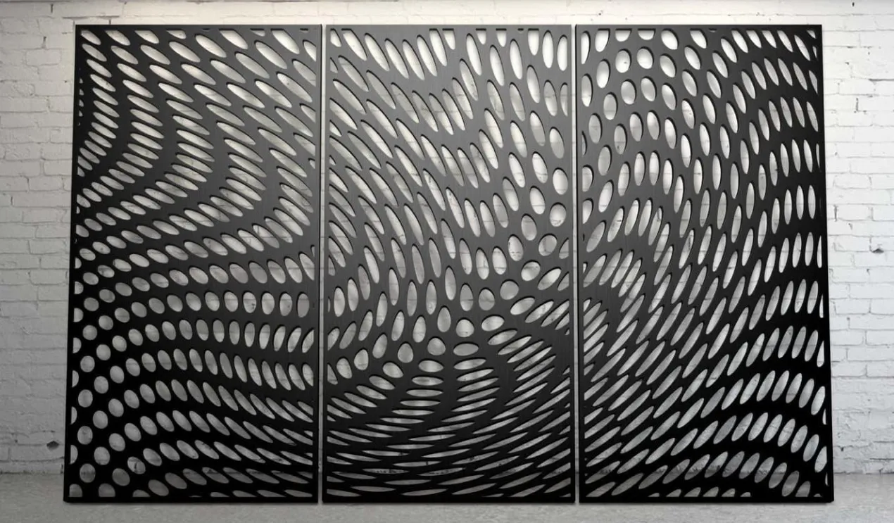 Three black aluminium panels with a flowing pattern of oval perforations mounted on a white wall