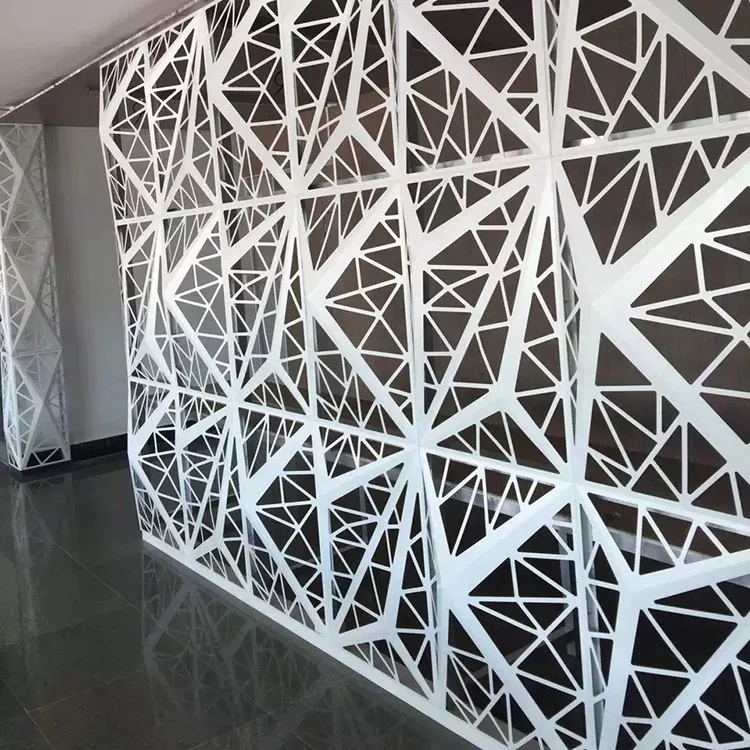White aluminium wall panels with a triangular geometric cut-out pattern